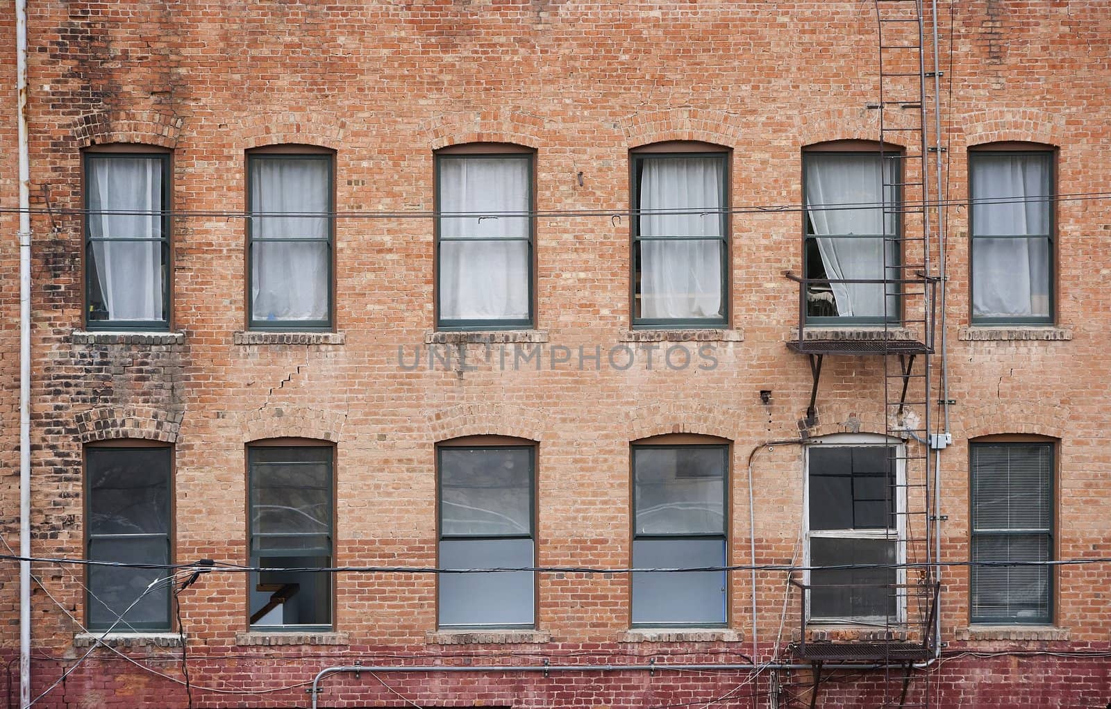 Many windows on a brick building from the 1800s in Bisbee Arizona