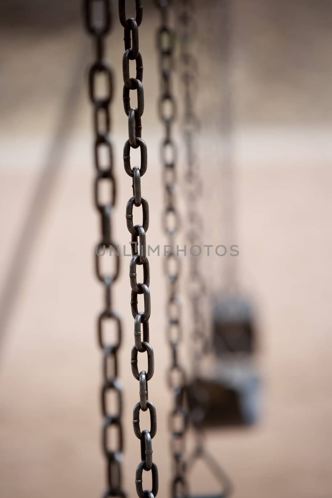 Chain on an old style playground swing 