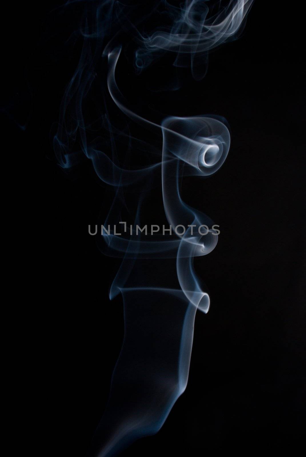 puff of aroma smoke on a dark background