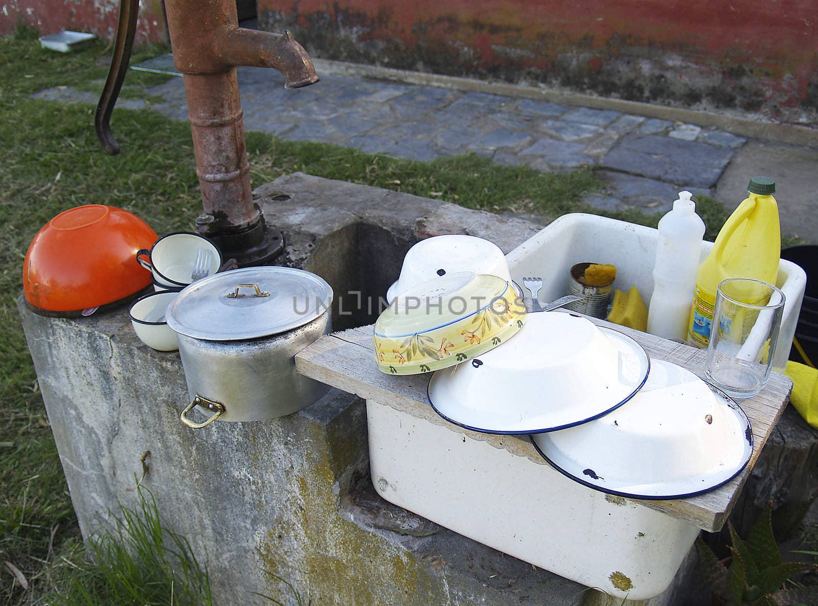 sink of field with pots and plates by lauria