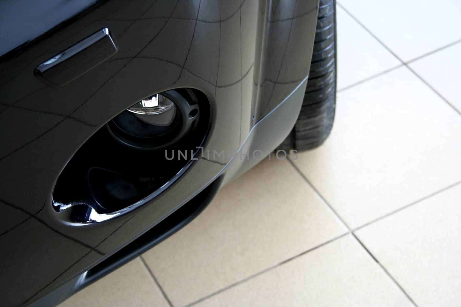 The black sports car on ceramic to a floor
