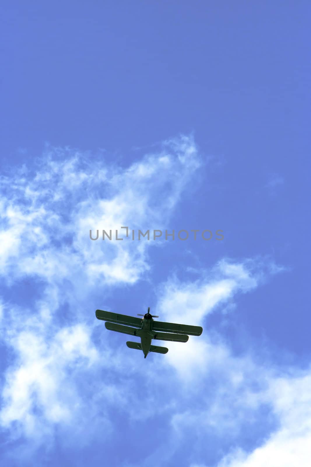 The plane on a background of the dark blue sky