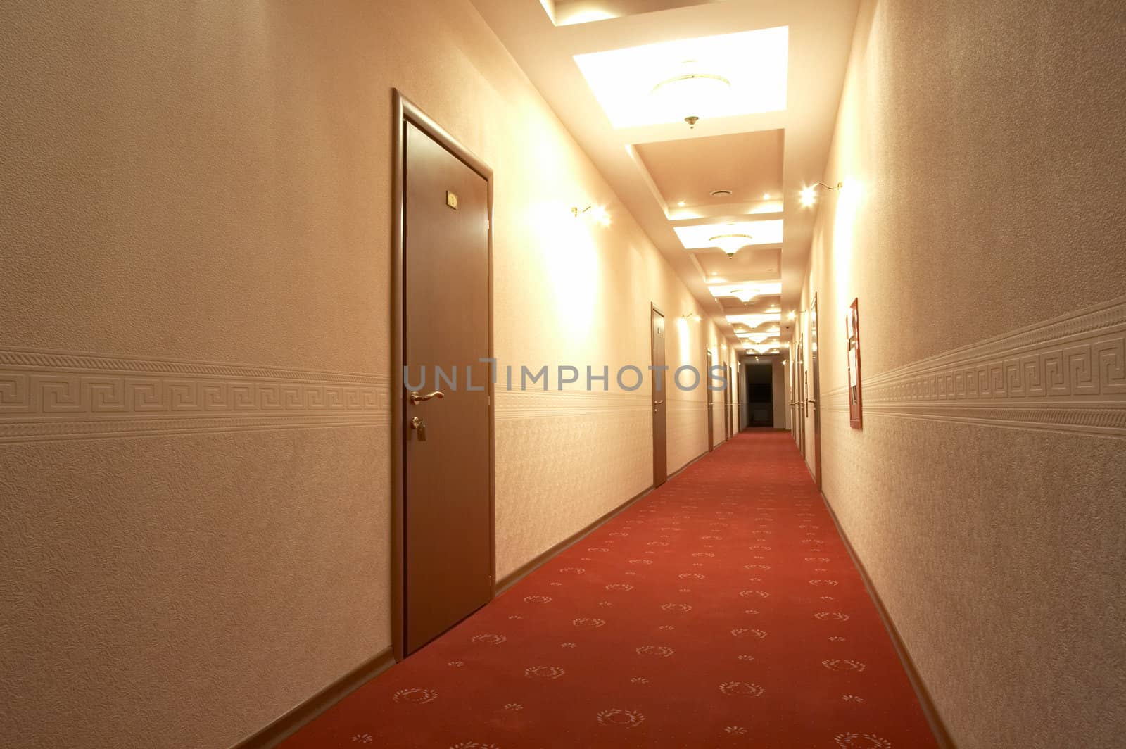 Corridor with a red carpet in hotel 