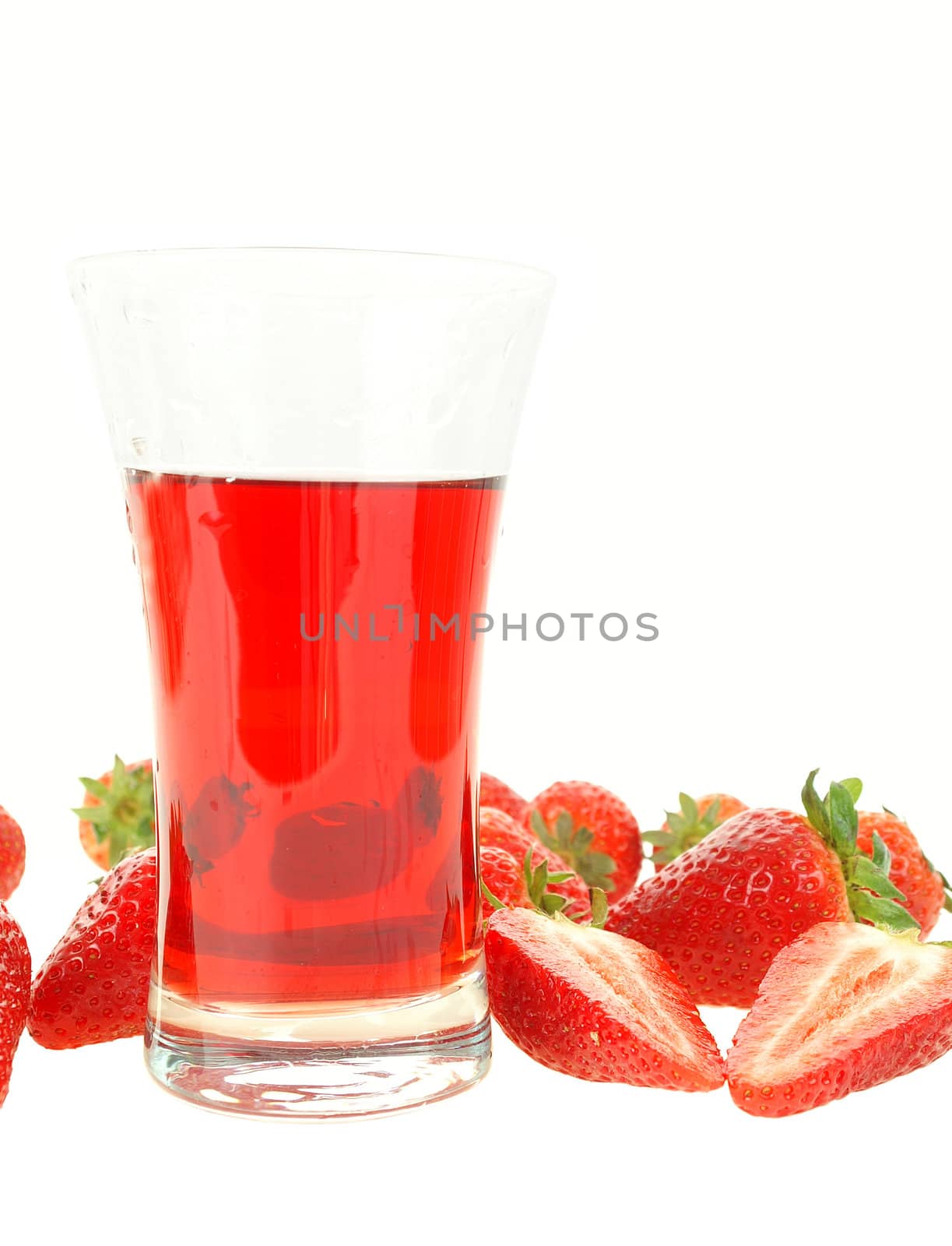 Fresh strawberry and juice in glass isolated