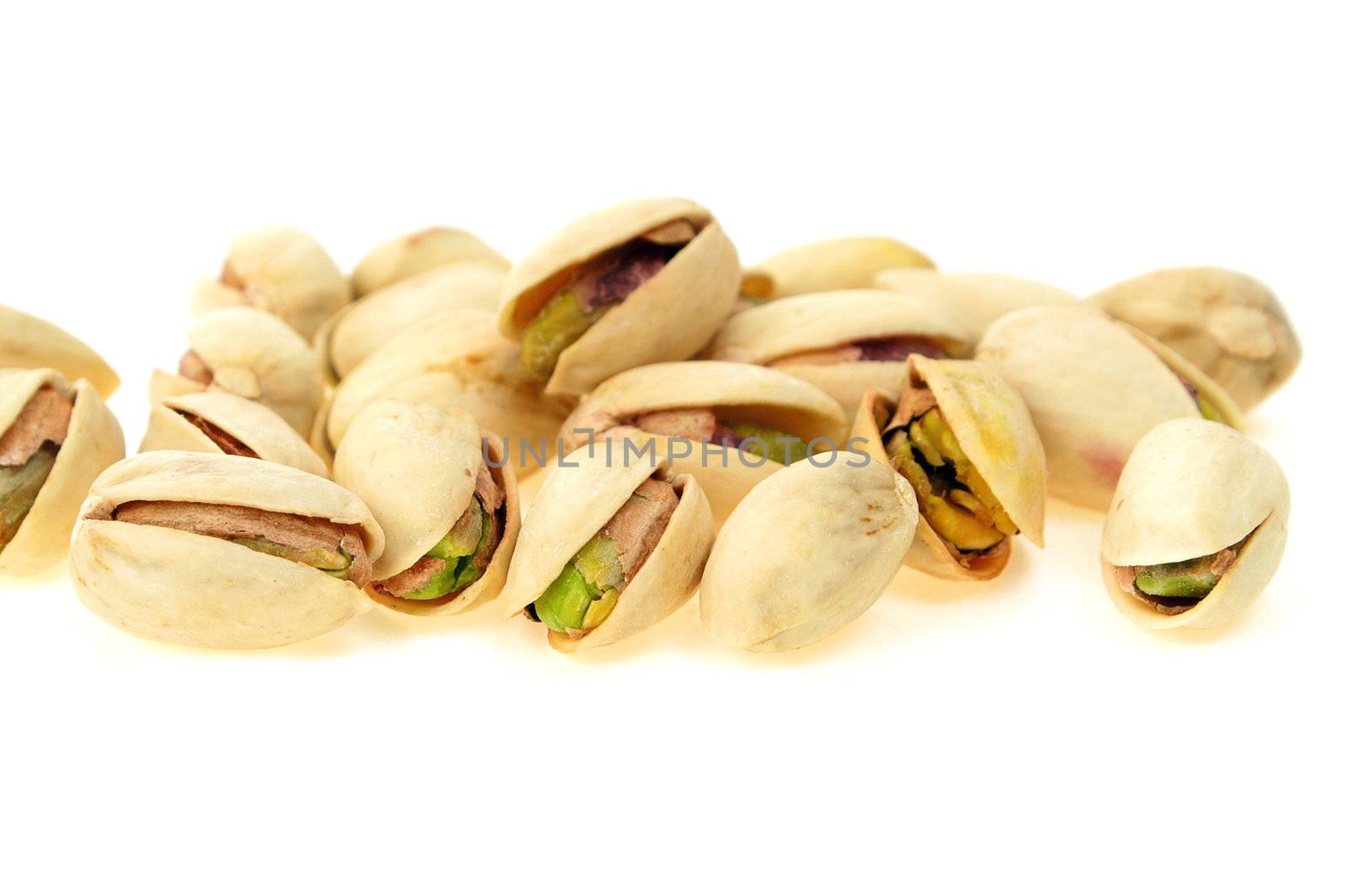 Pistachio nut close-up isolated on white background