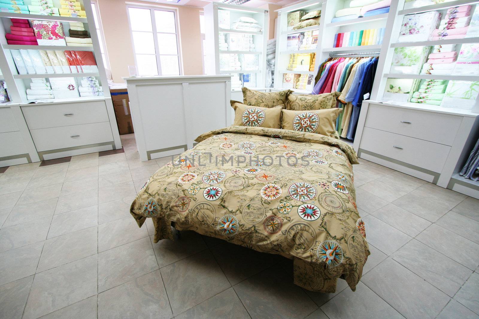 Modern and beautiful bed in shop of bed-clothes