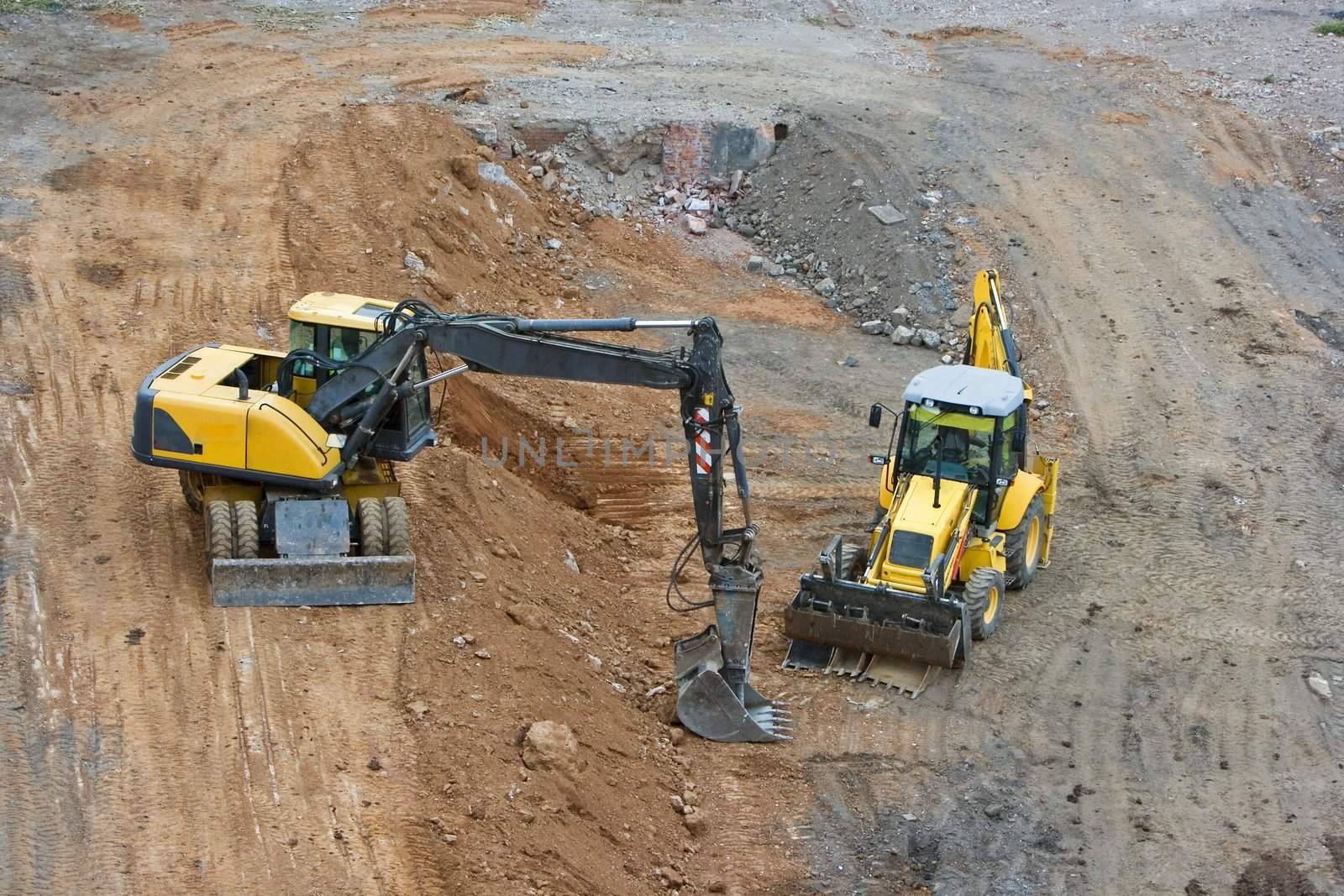 works in an industrial zone in construction witch excavator machines