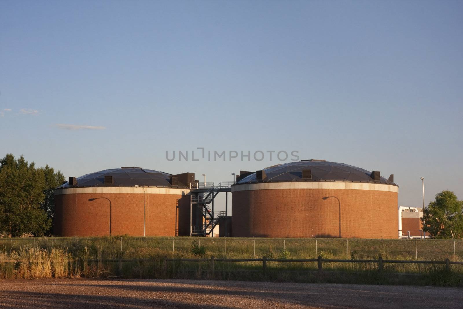 two brick round biotower structures at water reclamation facility, Fort Collins, Colorado