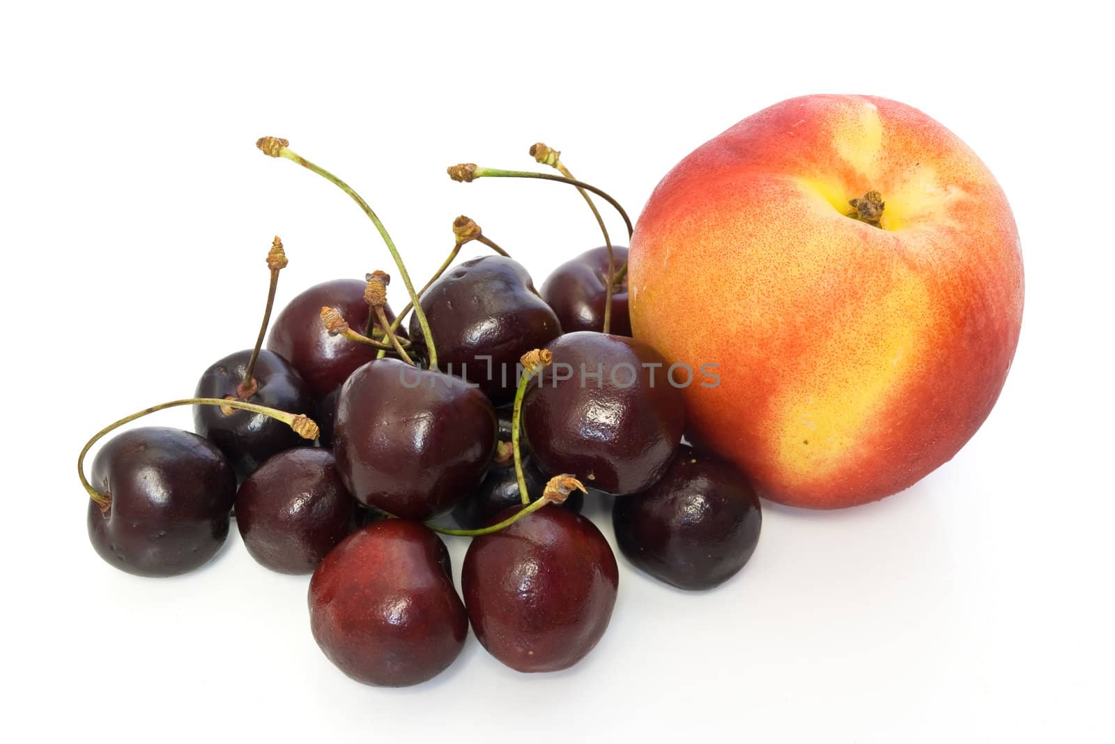 nectarine and cherries isolated on white background
