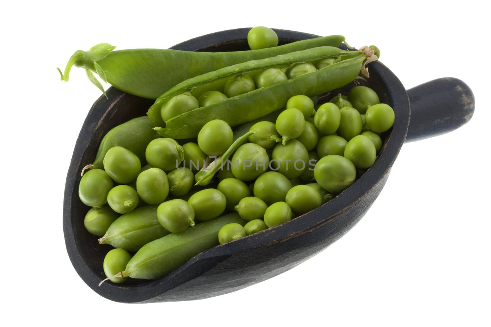 green pea fresh from garden on a rustic wooden scoop isolated on white