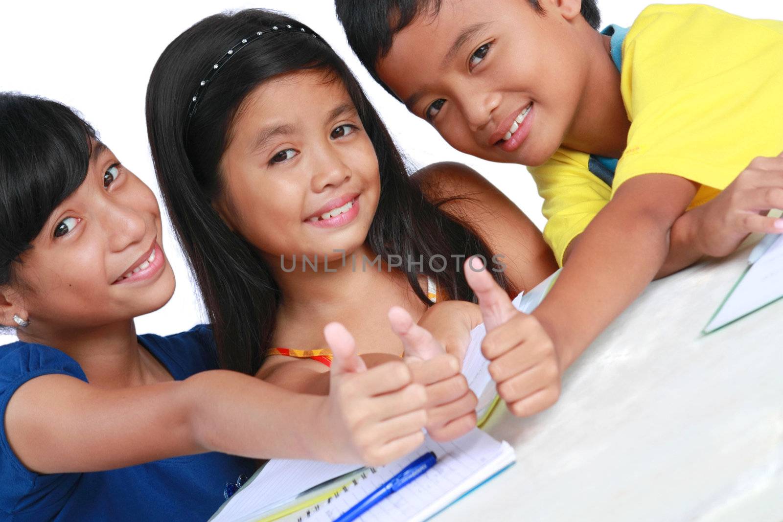 young asian students making a thumbs up sign