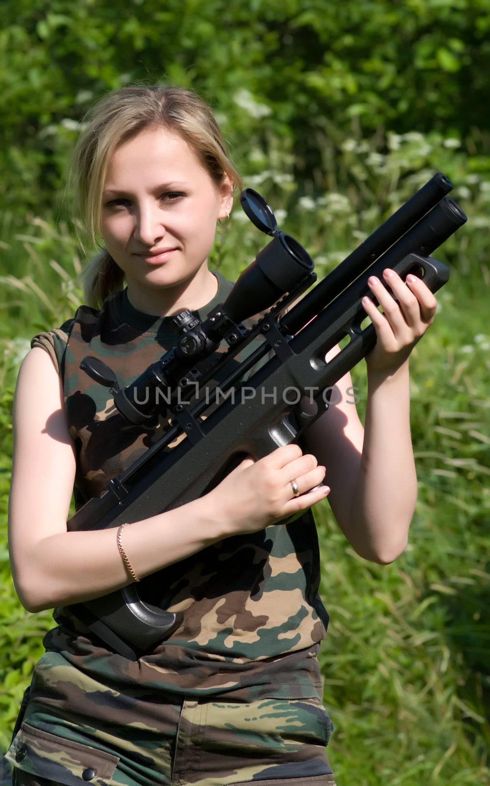 The nice young fair-haired girl with an air rifle.