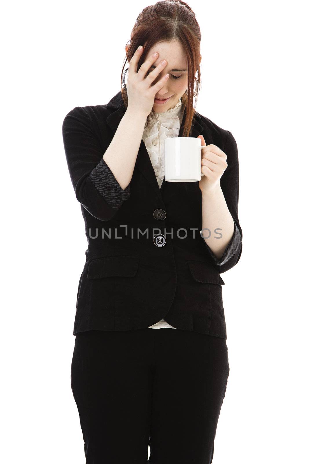 Young business woman with a cup of coffee and a expression of disbelief against white background