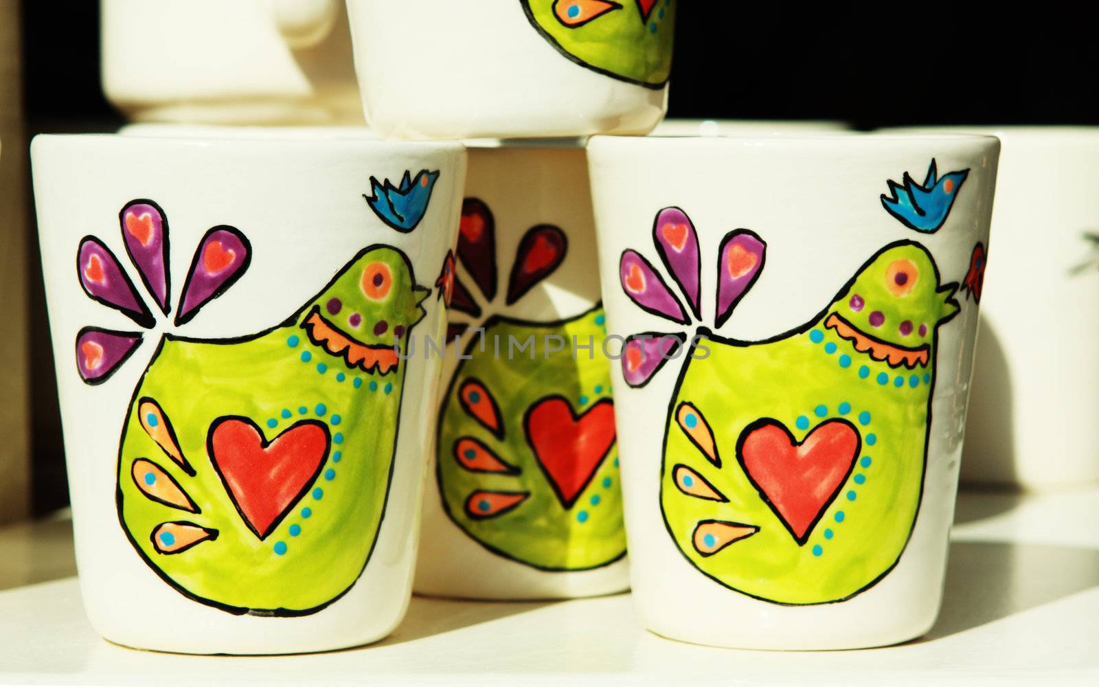 white cups with paintings