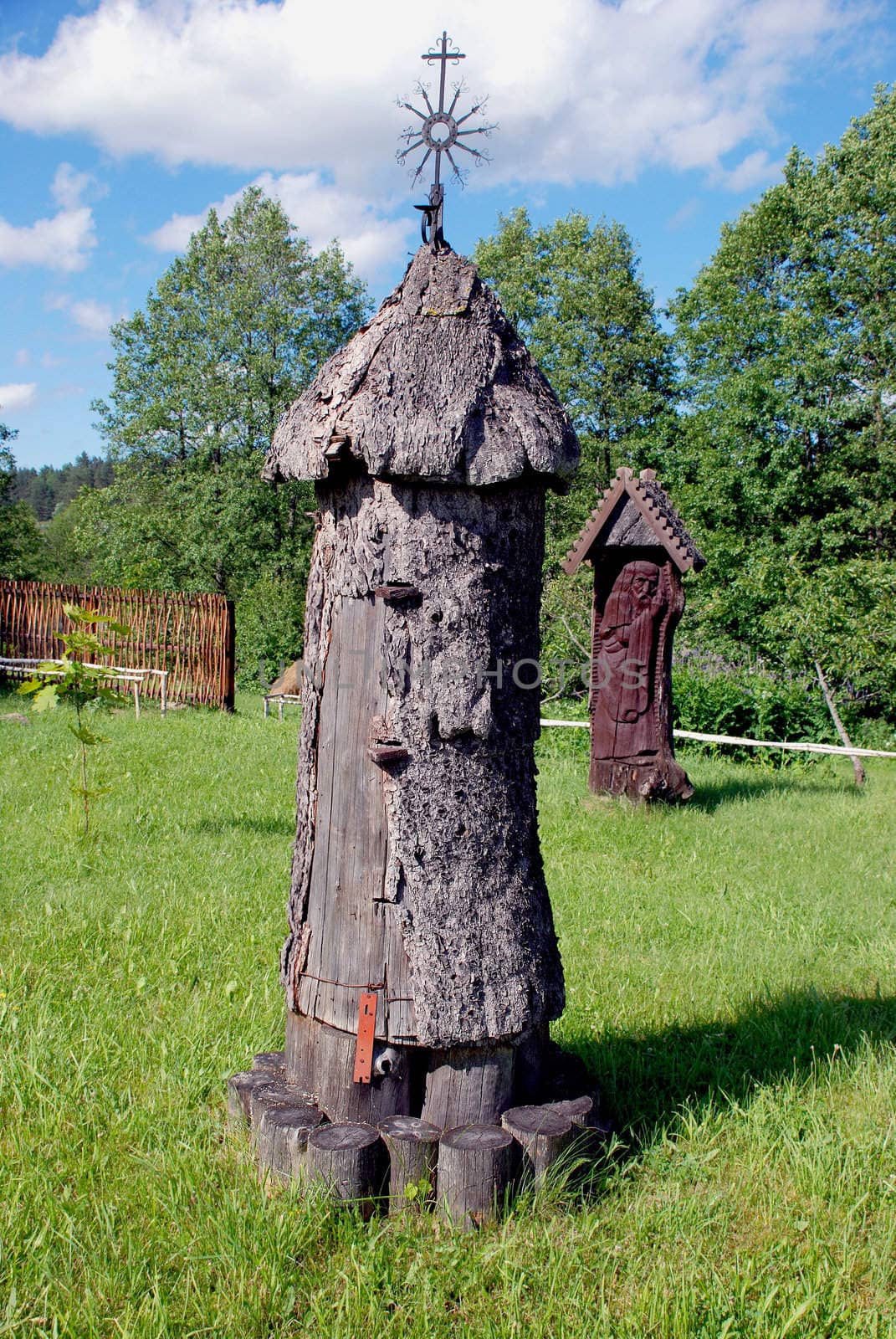 Ancient vertical bee hives made of logs. Beekeeping museum.