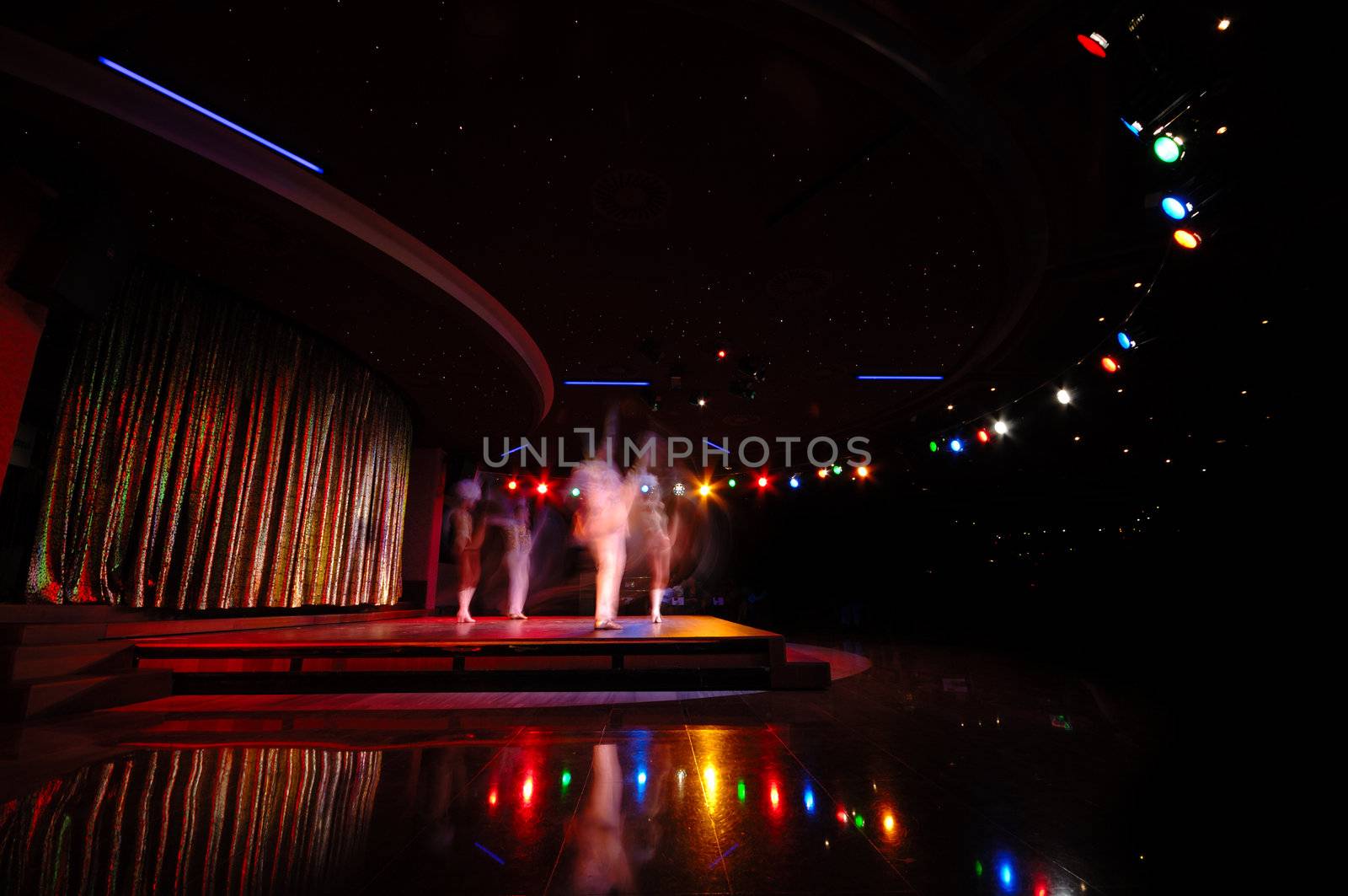 Dancers in a nightclub. Note that the dancers are in motion blur