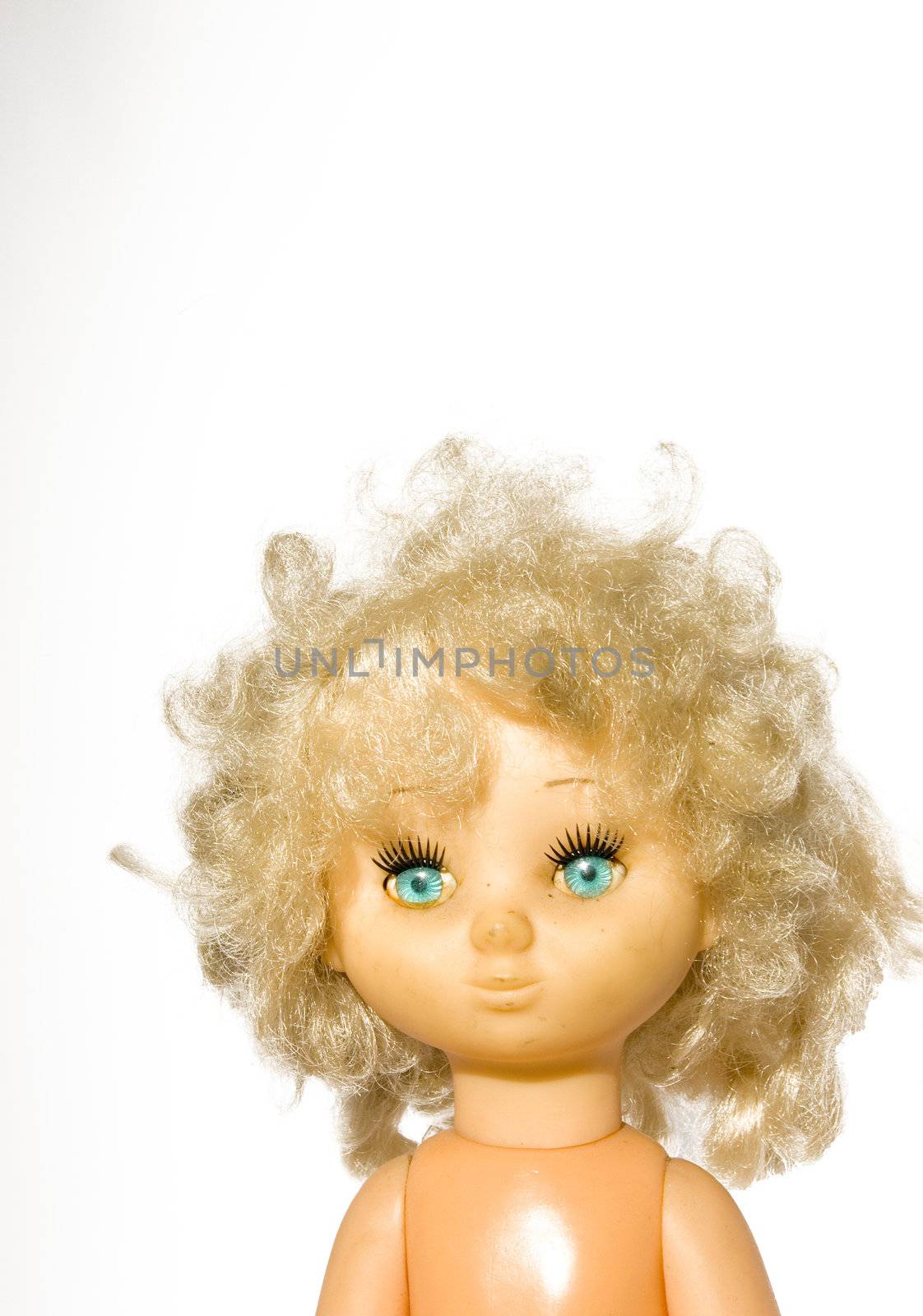 Vintage doll head with blue eyes and shock on a white background