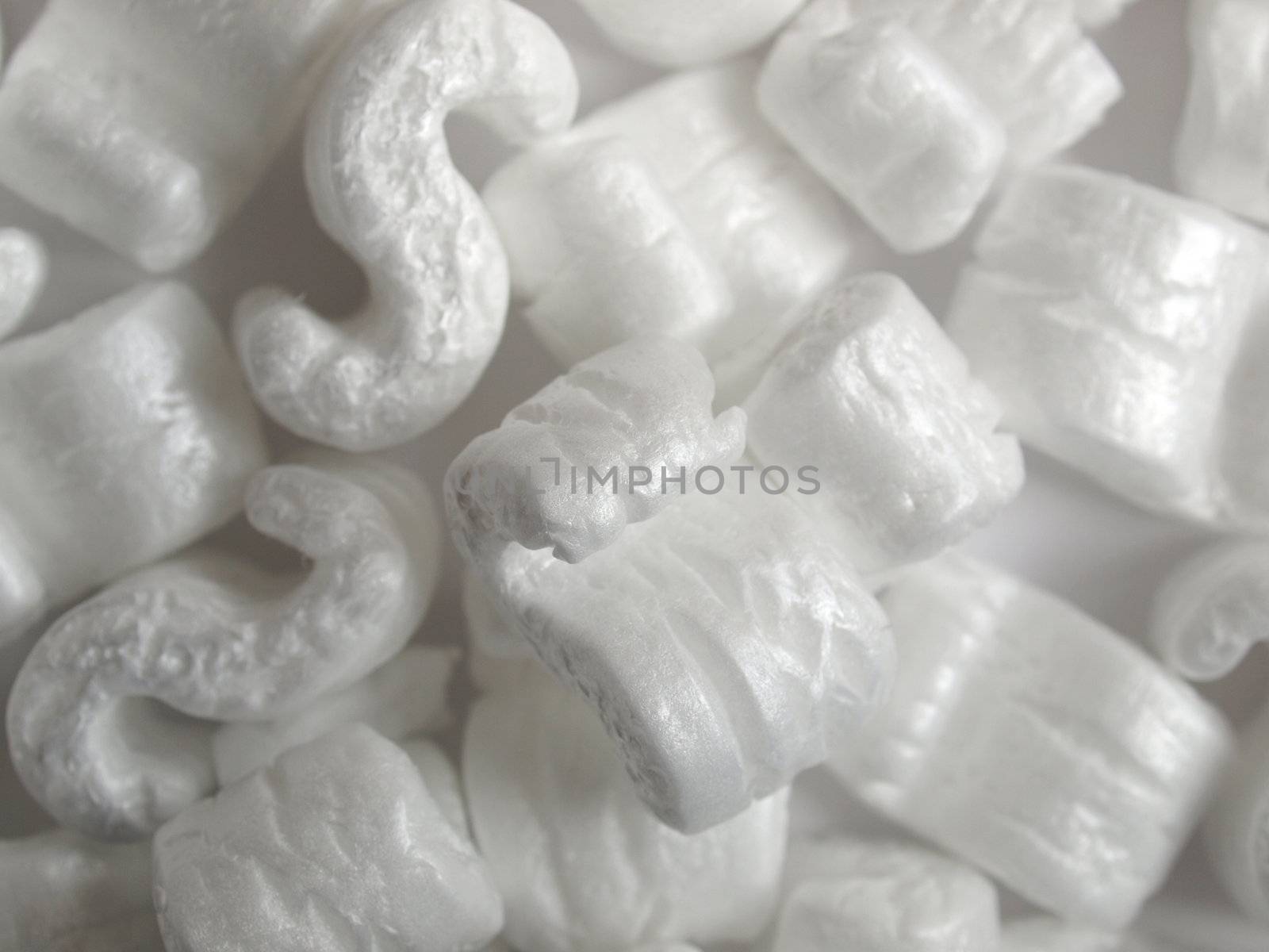 Expanded polystyrene beads for packaging useful as a background