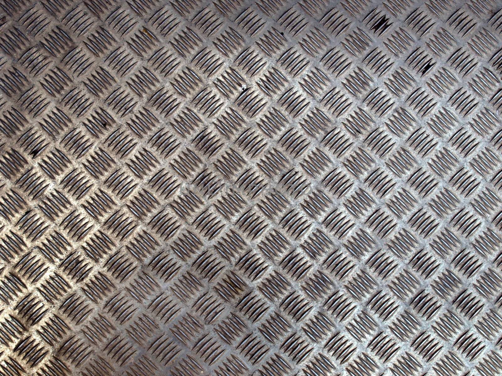 Diamond steel plate useful as a background