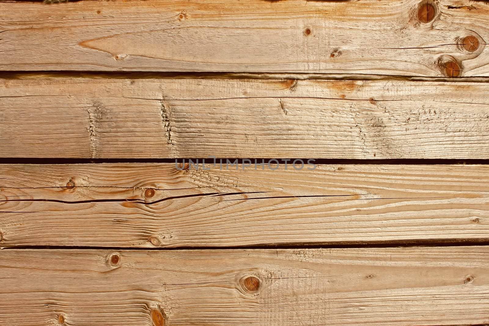 Horizontal parallel wooden old logs. Part of wooden house walls