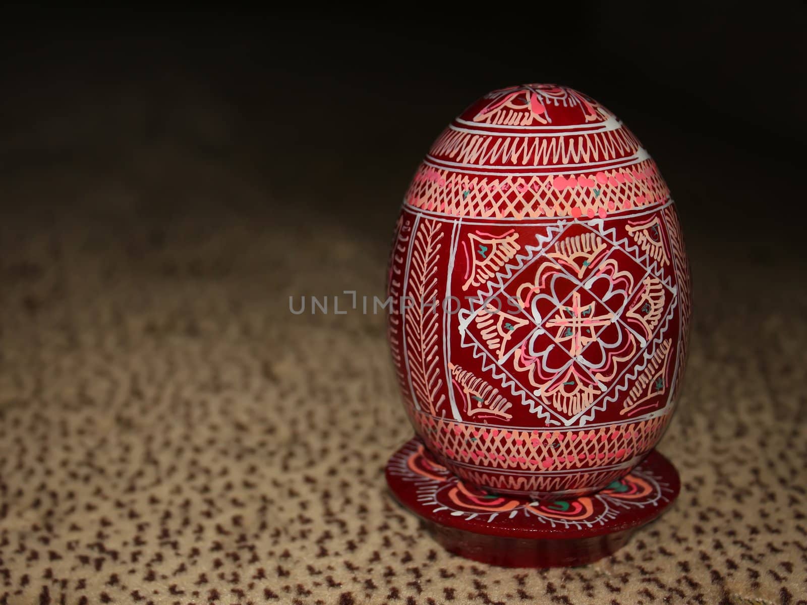 Painted Wooden Easter egg on the pedestal