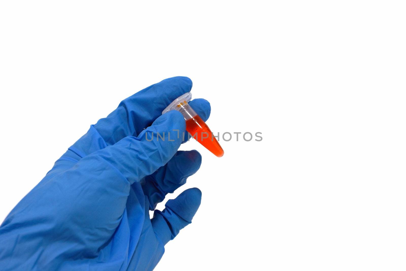 hand in glove with tube with blood isolated