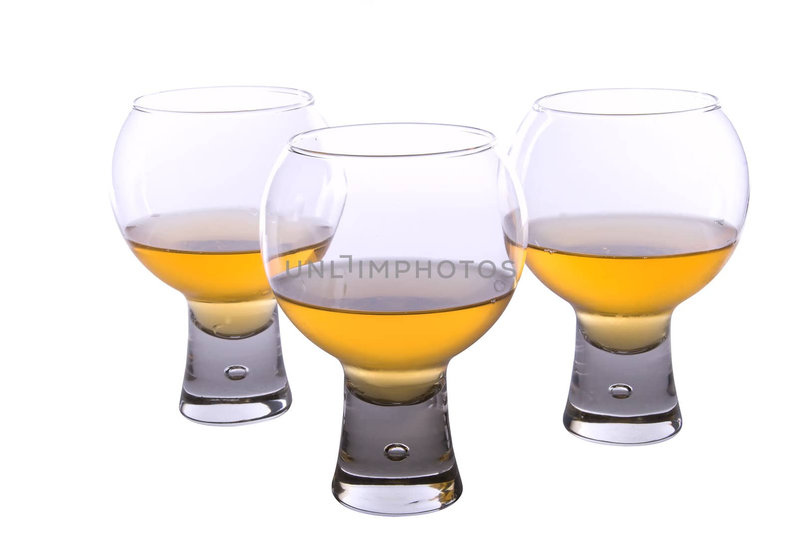 Set of three cognac glasses on white background by KRoman