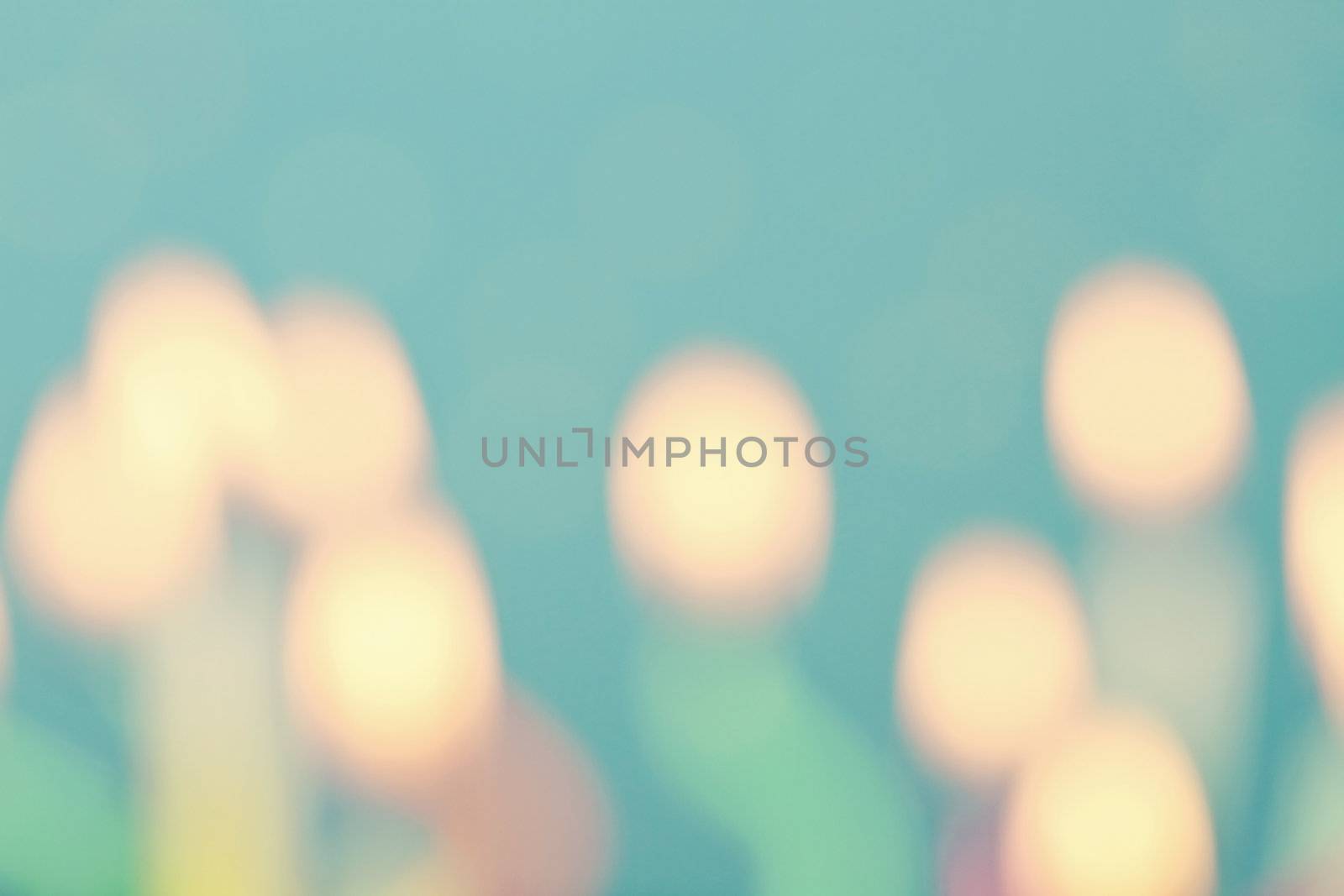 Blue abstract birthday candle bokeh background.