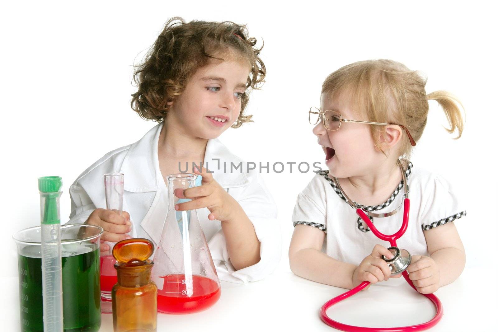 Two girls pretending to be doctor in the laboratory