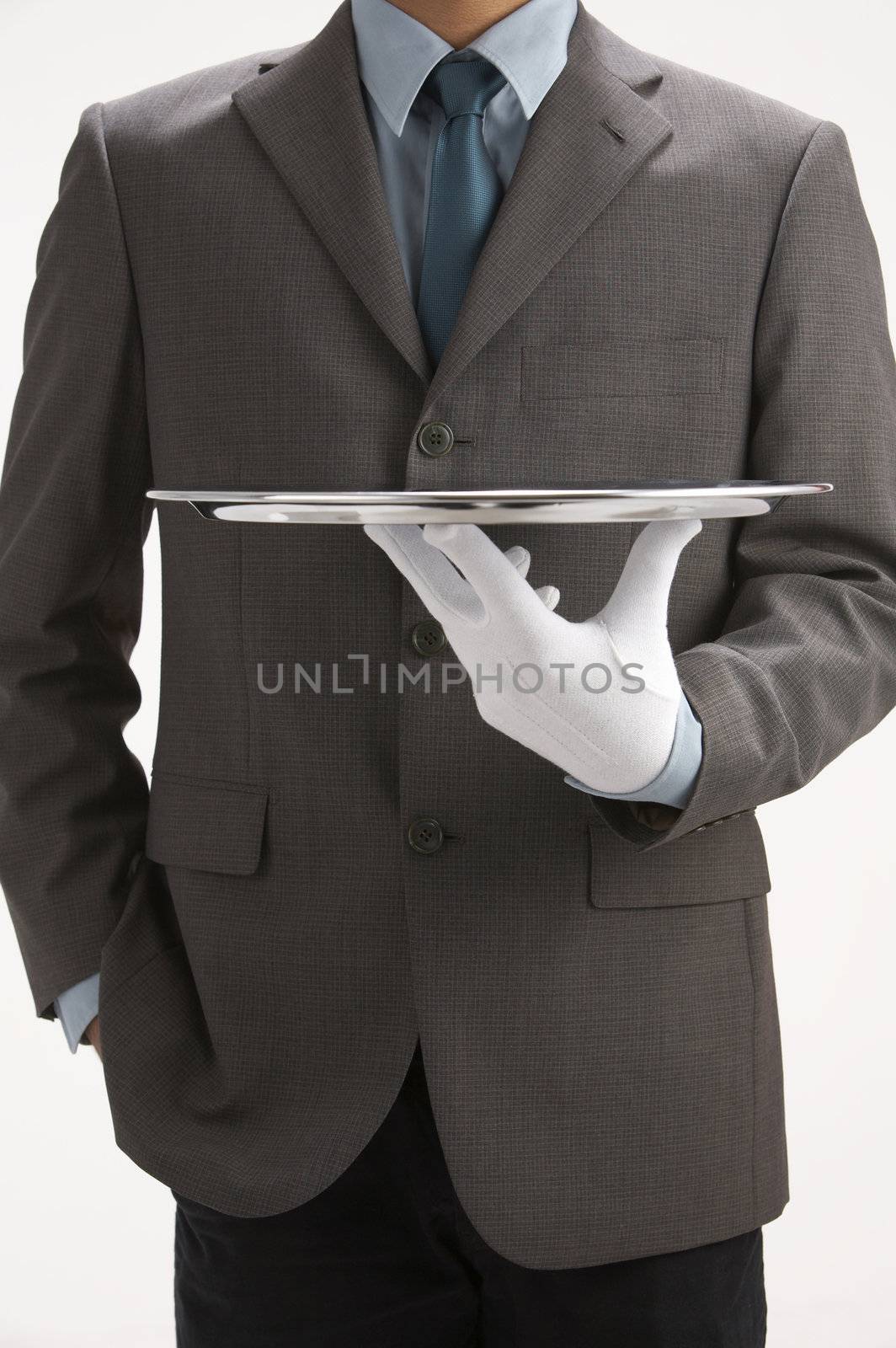 asale person holding a  sliver empty tray