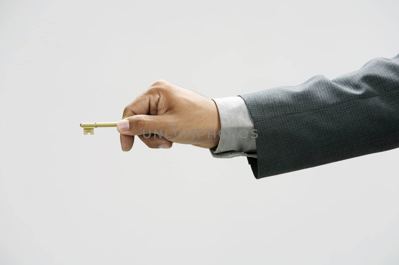 man showing a key with  the white background