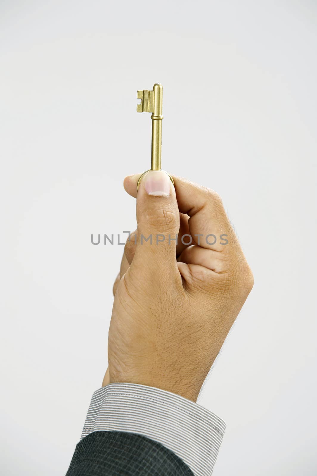 man showing a key with  the white background