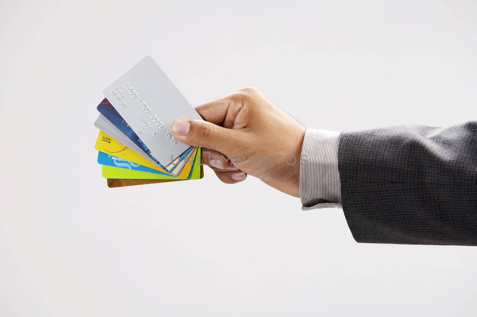 man showing few credit cards  by eskaylim