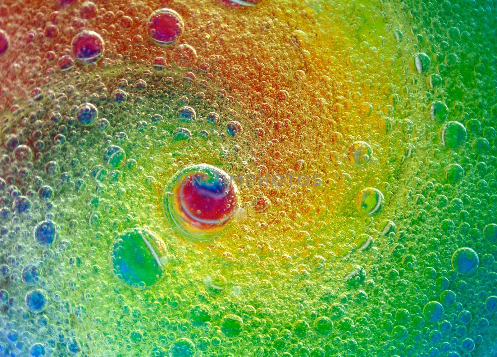 Water and oil drops in a psychedelic spiral