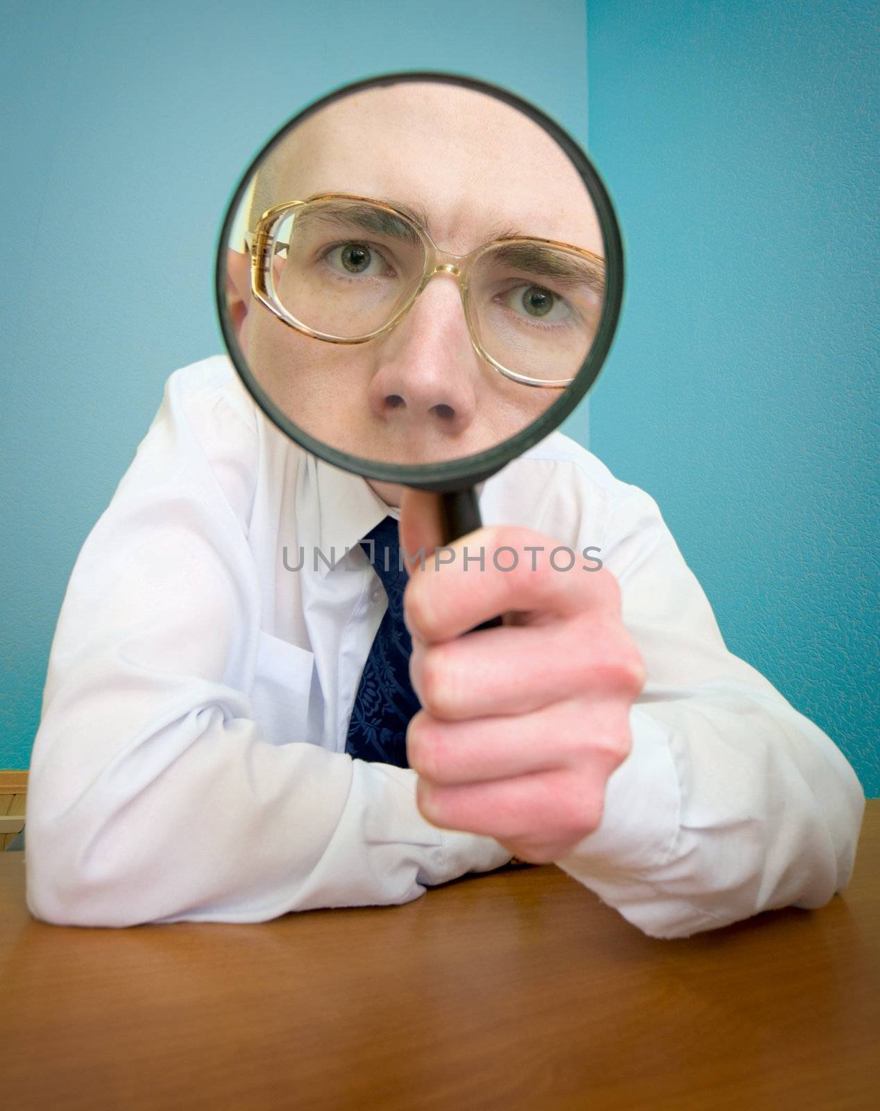 Funny people with a magnifier in a hand