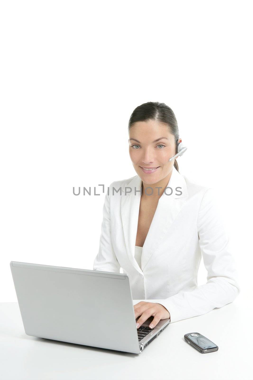 Beautiful businesswoman with headset telephone in white background