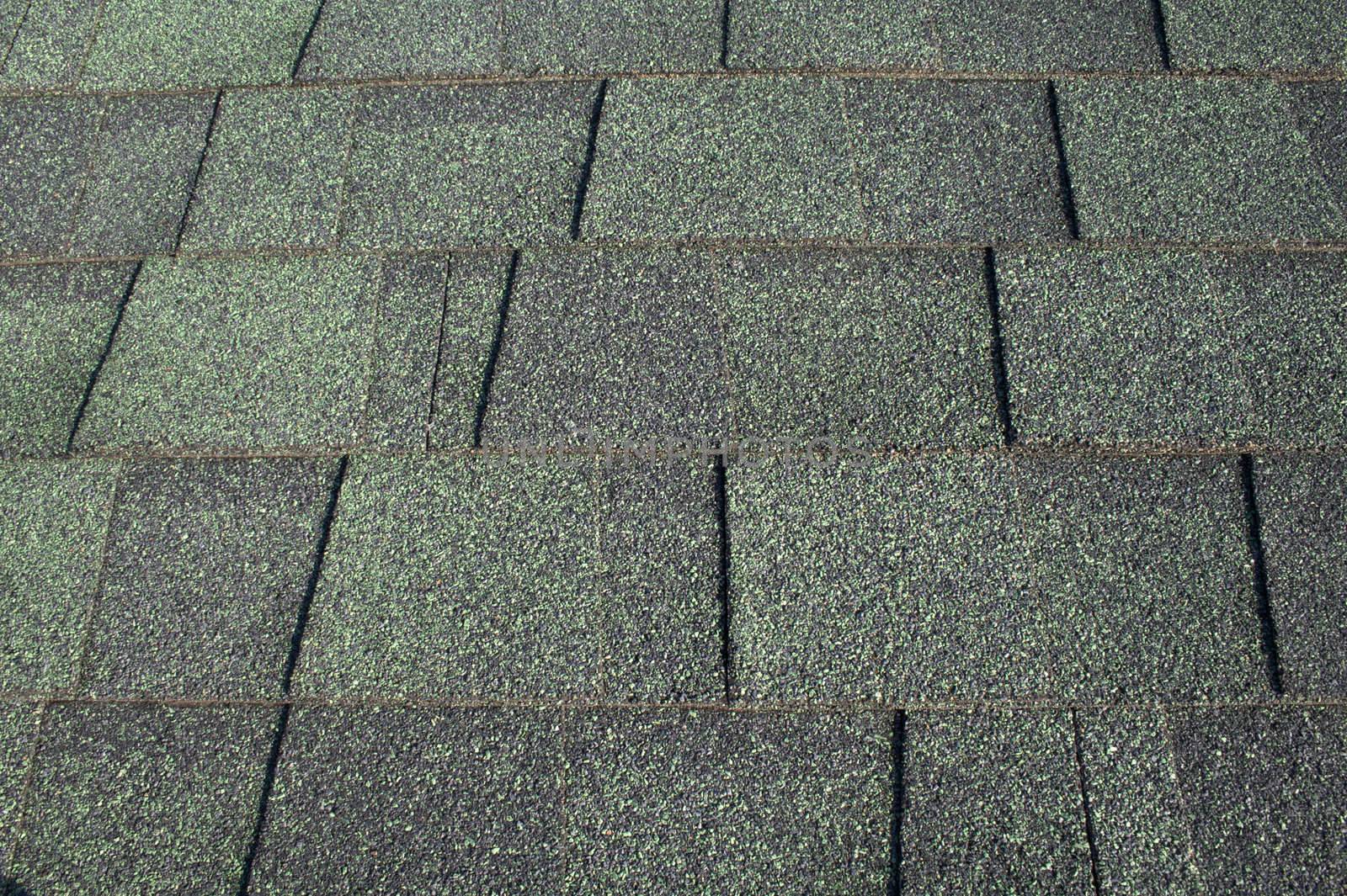 A background consisting of green asphalt shingles