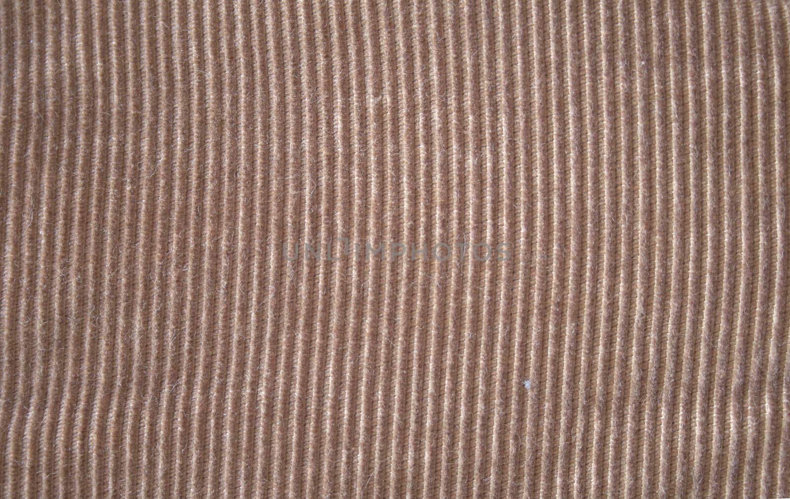A brownish tan or beige corduroy background texture