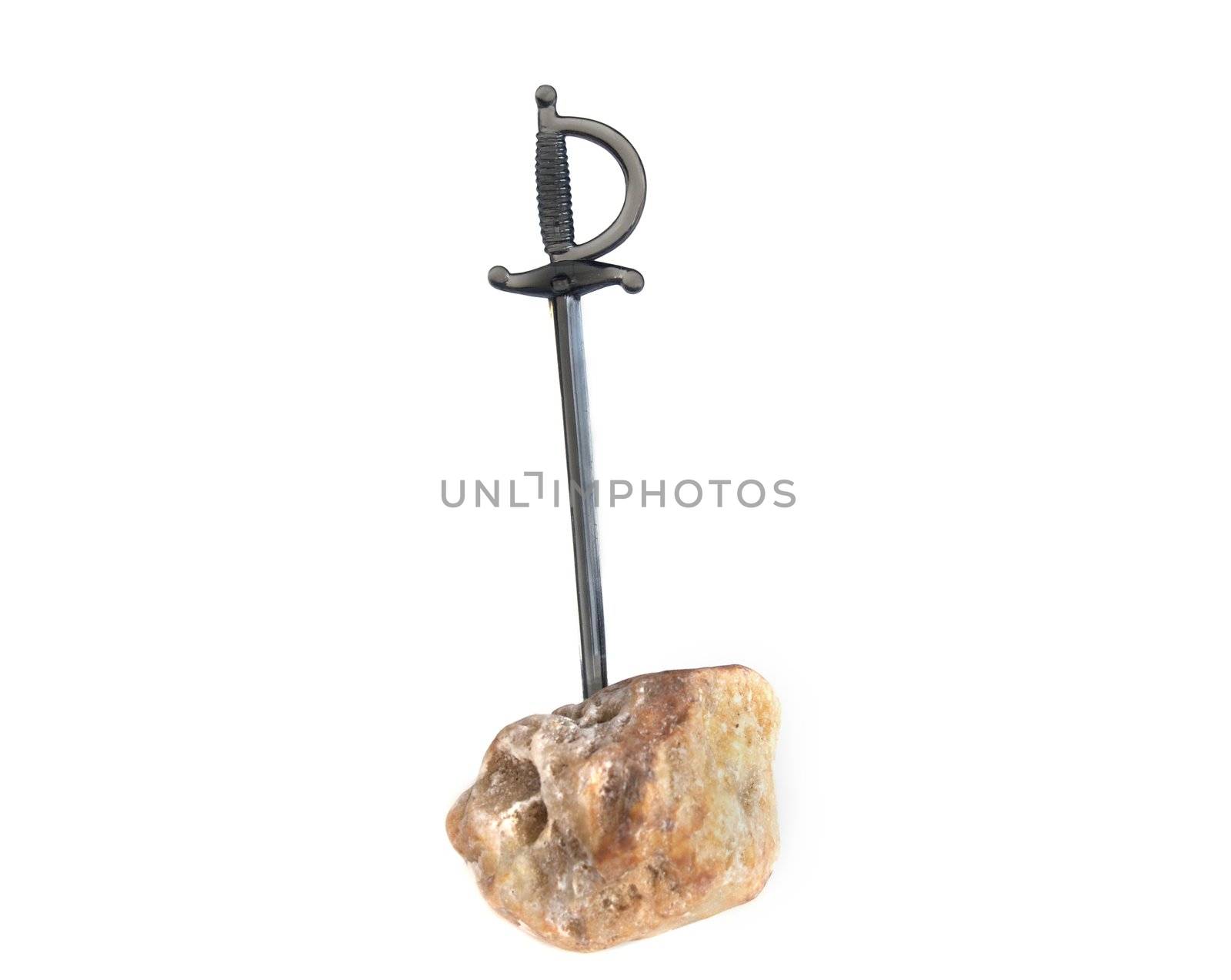 A cocktail sword stuck into a stone.