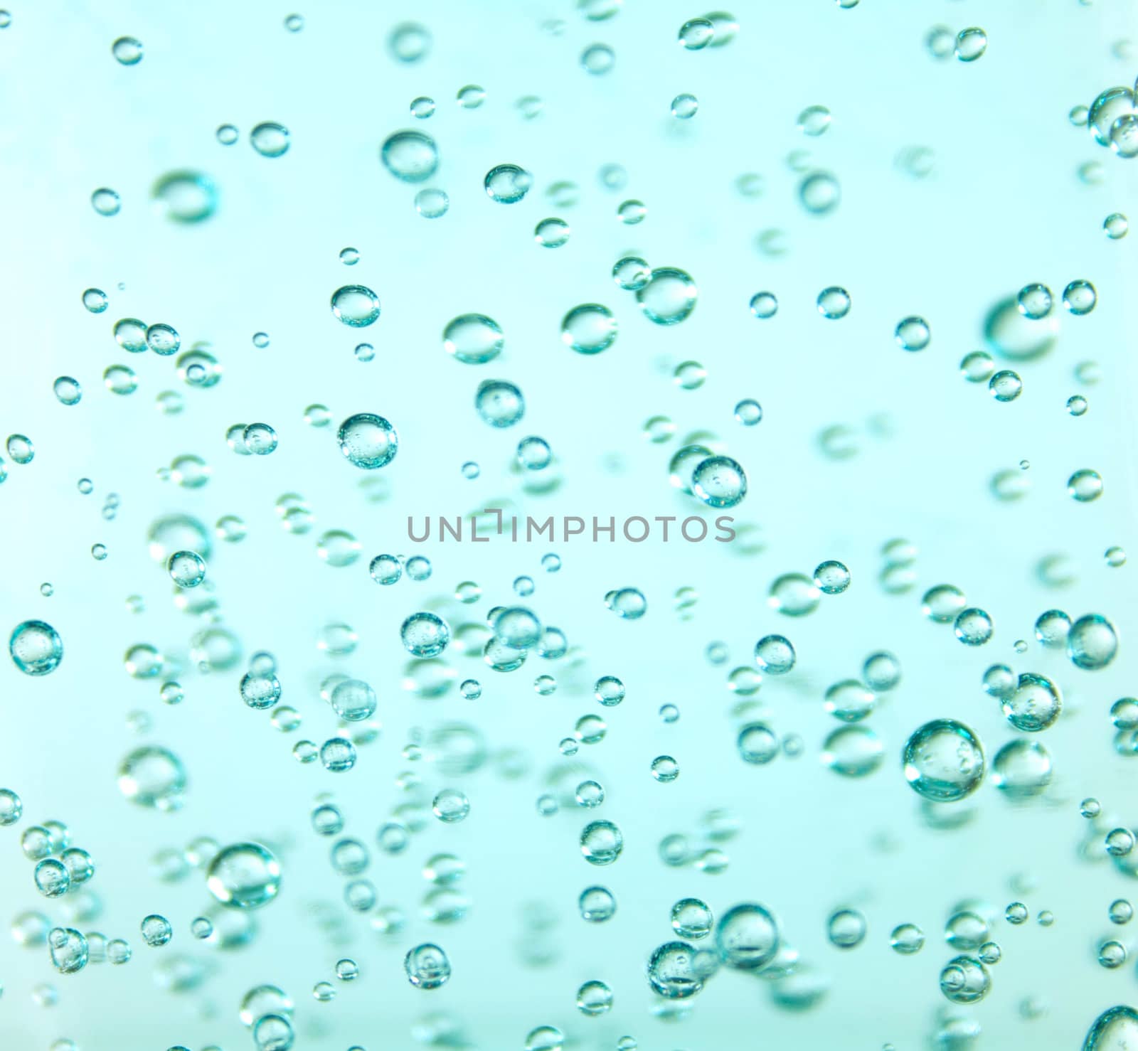 Clear bubbles suspended in a vibrant blue gel