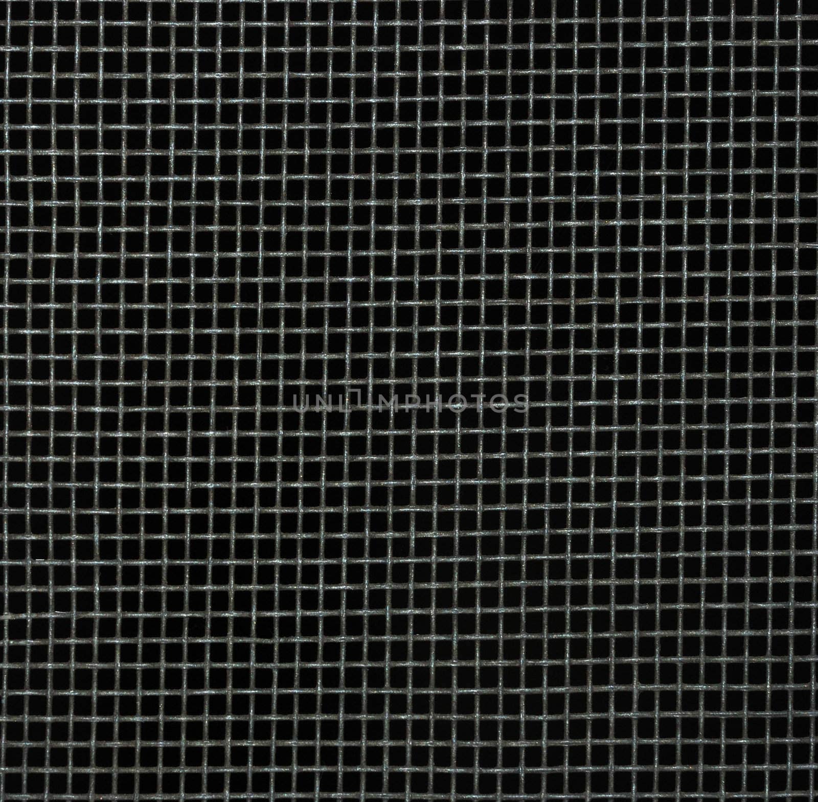 Screen door detail pattern against dark background.