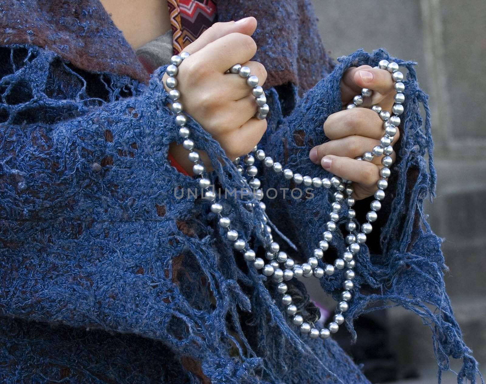 Nice pearkl beads in woman's hands