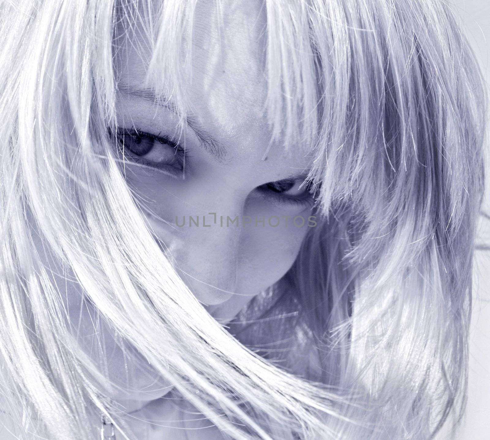 coquettish blond woman looking straight in monochrome