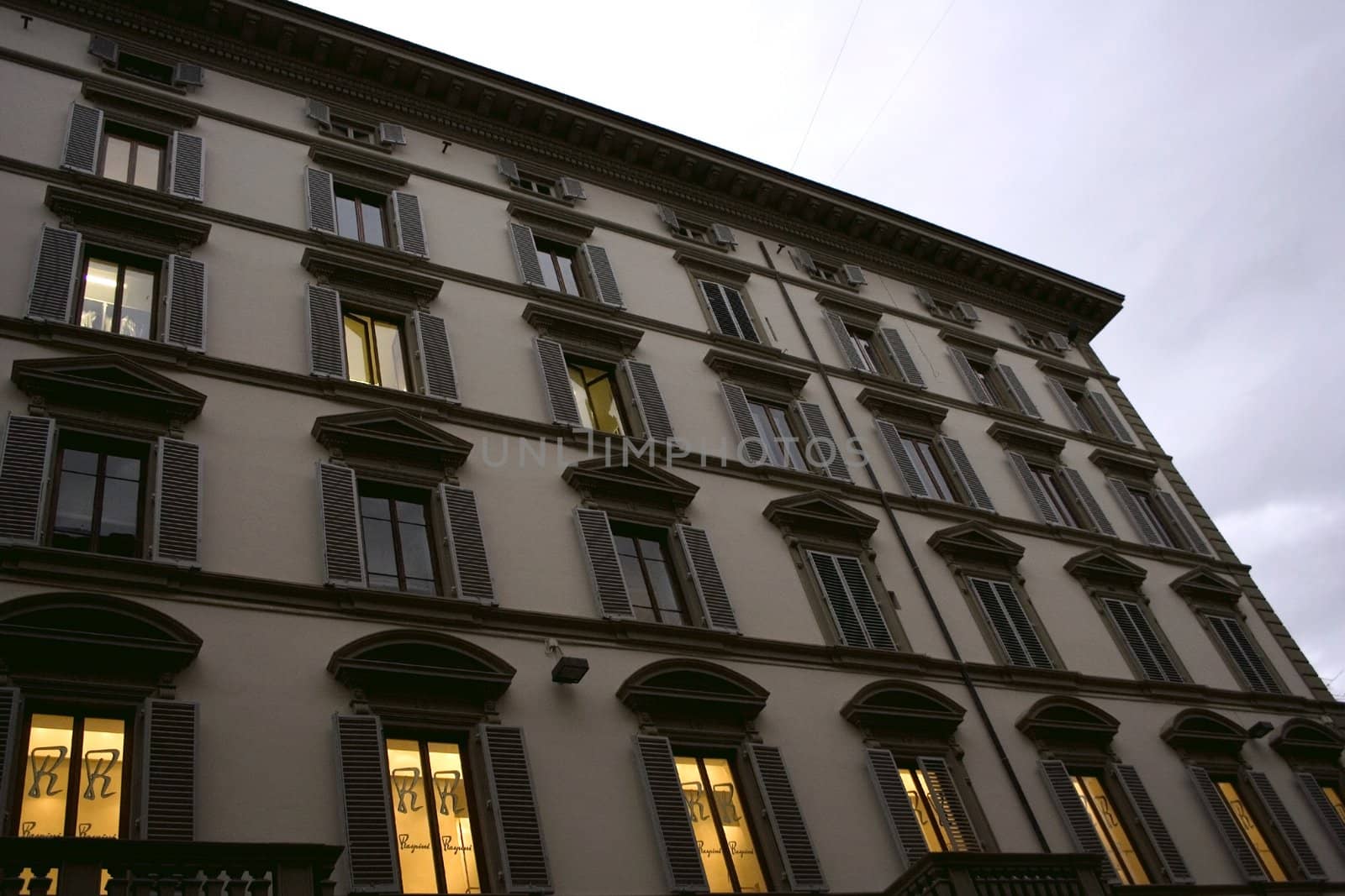 Romantic building with nice windows with shutters