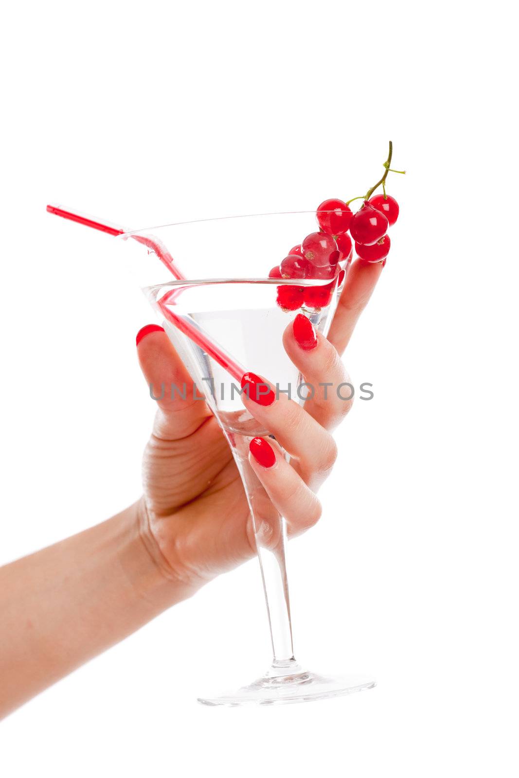 Female hand with bright red nails holding cocktail