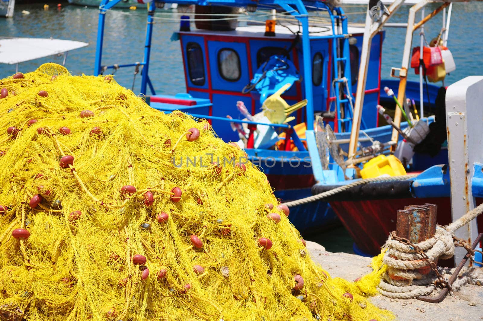 Travel photography: Fishing boat and nets. Port of Heraklion, Crete, Greece