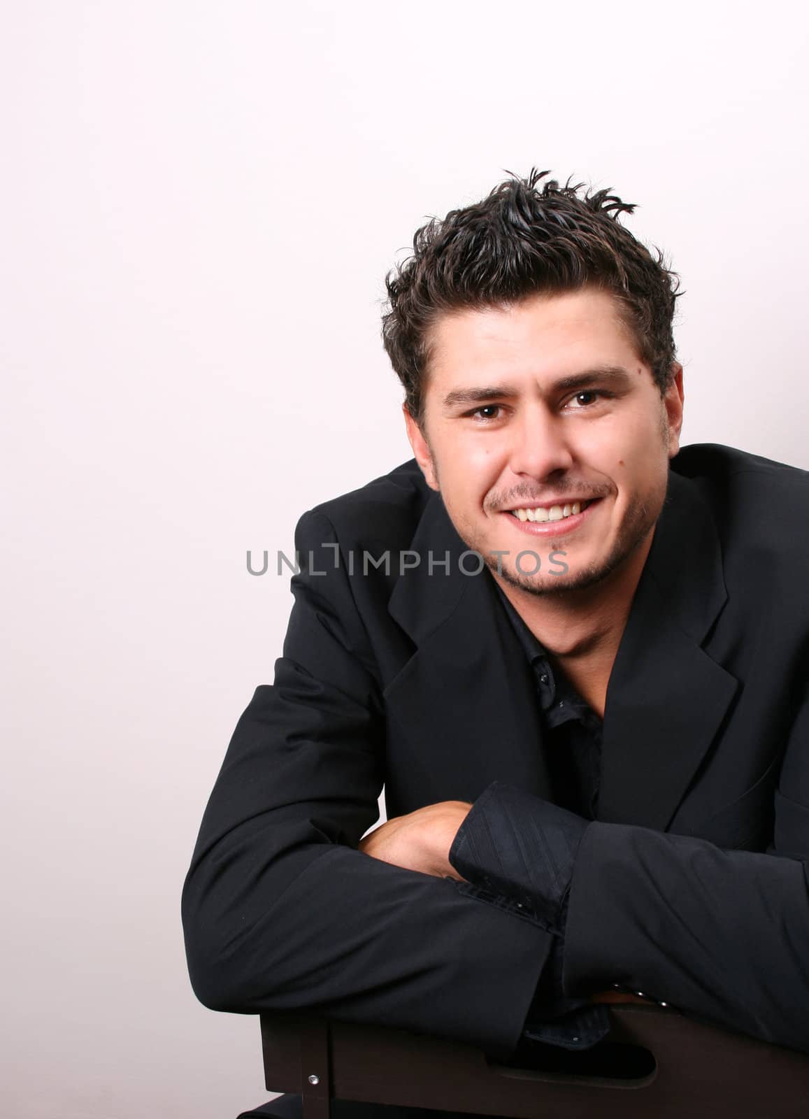 Male model in studio against white wall