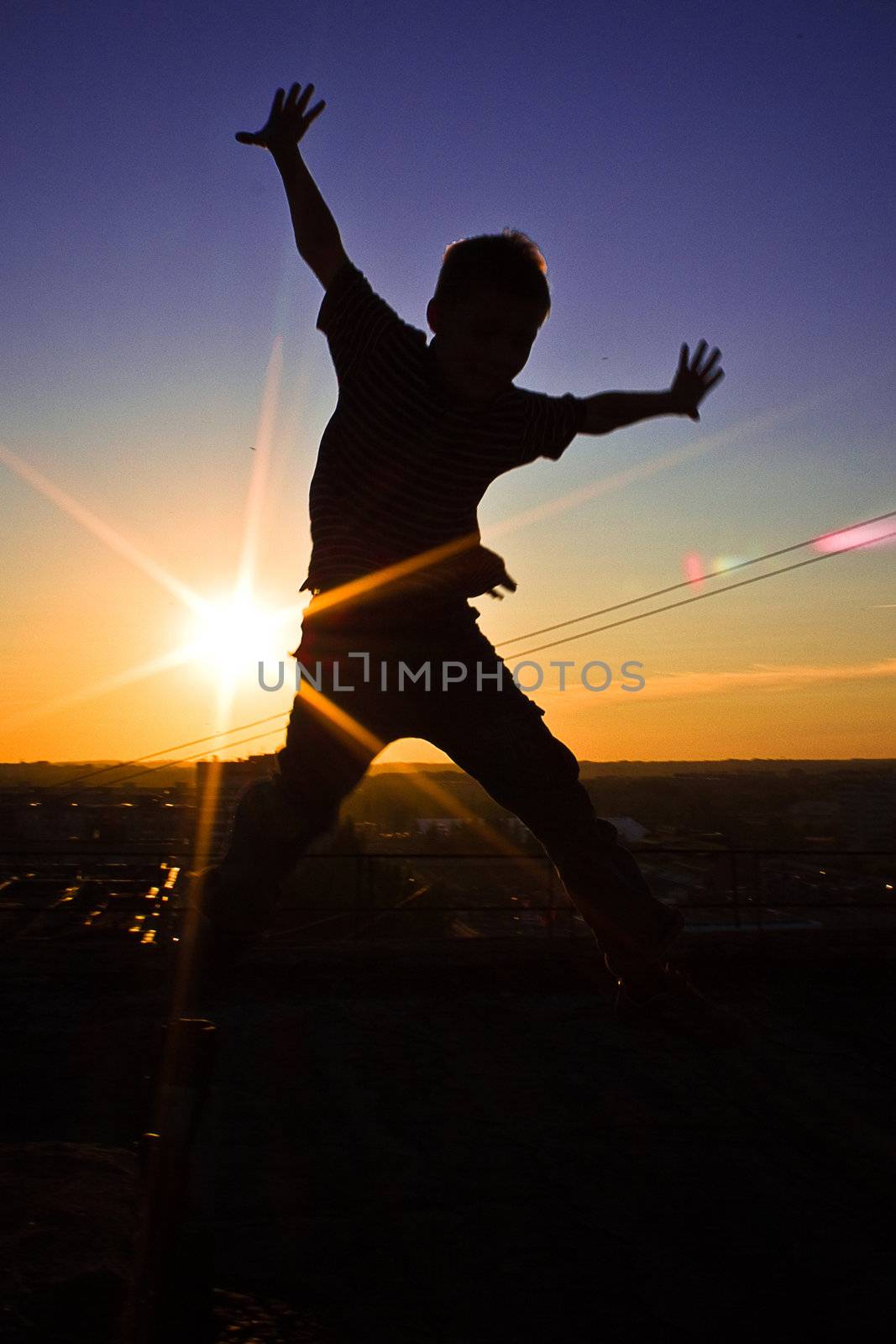 The silhouette of jumping boy