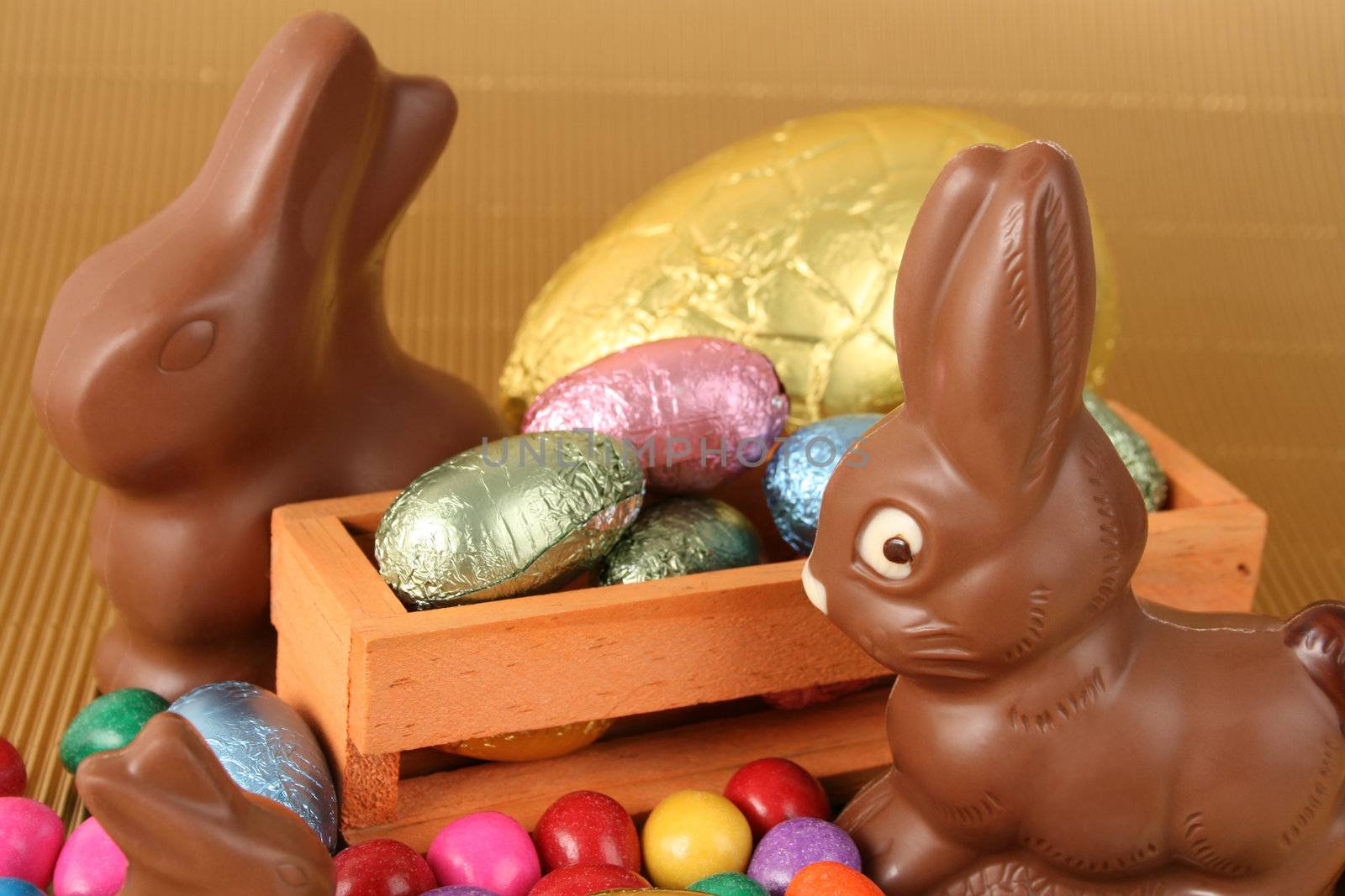 Various colors and shaped easter eggs and chocolate bunnies