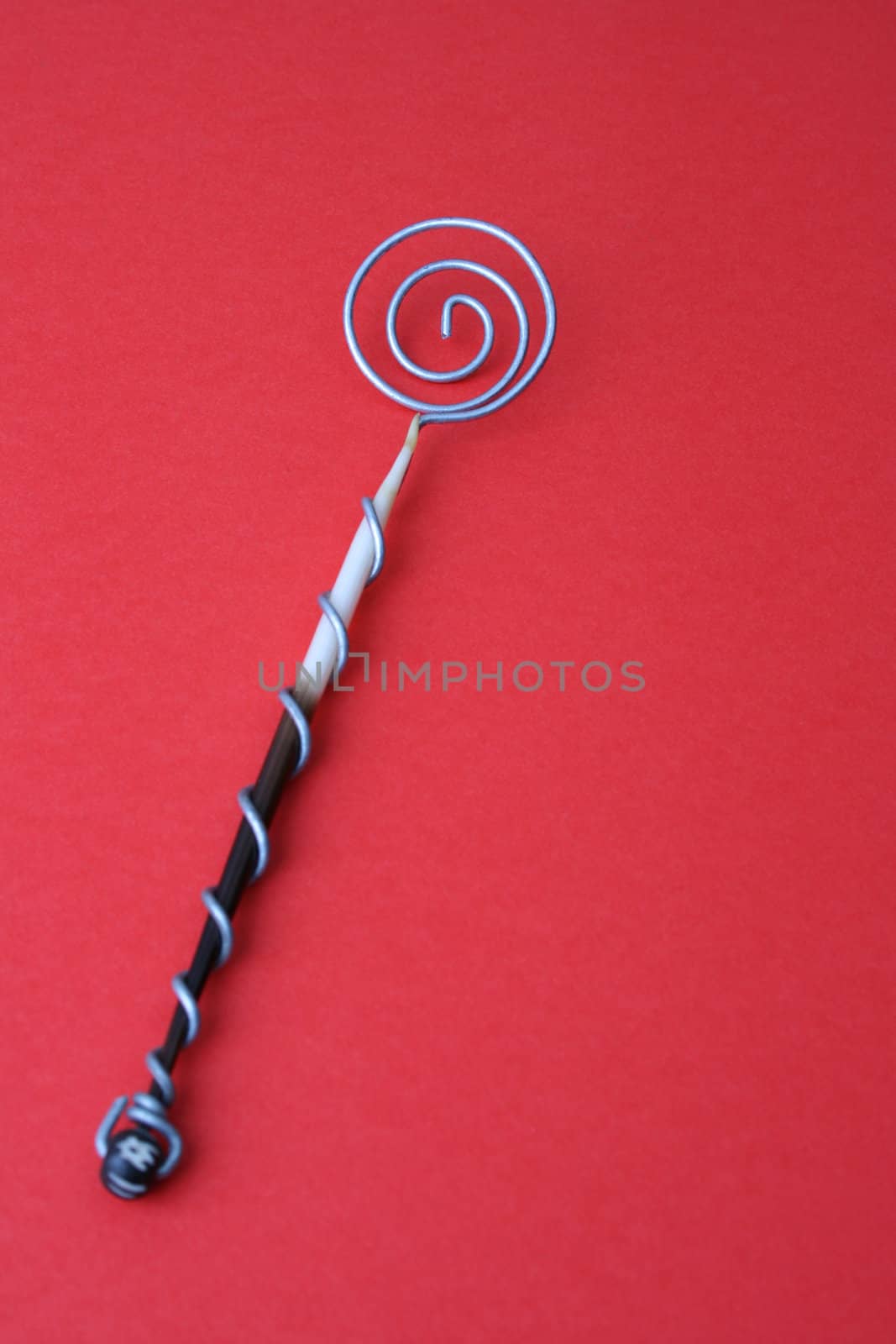Hand Made Quill spoons on a red background
